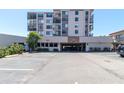 Exterior shot of the building with parking and covered parking garage at 6269 Palma Del Mar S Blvd # 308, St Petersburg, FL 33715