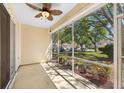 Enjoy the view from this screened porch, perfect for relaxation and potted plants at 6412 Rosefinch Ct # 102, Lakewood Ranch, FL 34202