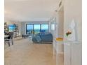 Bright living room featuring expansive water views, comfortable seating, and stylish decor at 755 S Palm Avenue # 604, Sarasota, FL 34236
