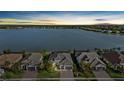 An aerial view of the home, showcasing the lake view and the surrounding community at 8016 Grande Shores Dr, Sarasota, FL 34240