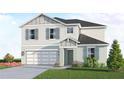 Charming two-story house featuring light blue accents, a well-kept lawn, and an attached garage at 13040 Cedar Elm Lane, Parrish, FL 34219