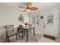 Cozy dining area with decorative ceiling fan and lovely natural lighting at 1536 Leisure Dr # N4, Bradenton, FL 34207