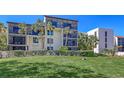 Charming condo building features private balconies, beautiful landscaping, and a lush green lawn at 1935 Gulf Of Mexico Dr # G7-402, Longboat Key, FL 34228