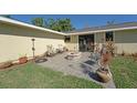 Outdoor patio features a stone fire pit and comfortable seating area at 2316 Bradford St, Sarasota, FL 34231