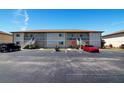 Exterior of condo building showing parking and stairways at 25275 Rampart Blvd # 1203, Punta Gorda, FL 33983