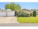 Charming single-story home showcasing a well-manicured lawn and inviting front entrance at 3328 Dartmouth Ln # 1012, Sarasota, FL 34239