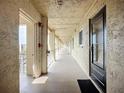 Inviting outdoor hallway with secure entry door, offering a safe and private access point to the condominium unit at 3821 Lake Bayshore Dr # H-507, Bradenton, FL 34205
