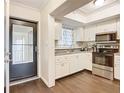 Well-lit kitchen with stainless steel appliances and granite countertops, offering a modern cooking space at 3821 Lake Bayshore Dr # H-507, Bradenton, FL 34205