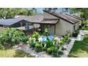 Charming outdoor seating area with lovely garden views; perfect for relaxing outdoors at 3842 Glen Oaks Manor Dr, Sarasota, FL 34232