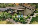 Charming outdoor seating area with lovely garden views; perfect for relaxing outdoors at 3842 Glen Oaks Manor Dr, Sarasota, FL 34232