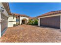 Beautiful home with brick paver driveway, three-car garage and stone-accented entry at 909 143Rd Ne St, Bradenton, FL 34212