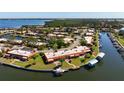 Waterfront condo community featuring boat docks, mature landscaping, and convenient water access at 9619 Valencia Cv, Bradenton, FL 34210