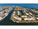 Scenic aerial view of waterfront condos with easy access to the bay, surrounded by lush landscaping at 9619 Valencia Cv, Bradenton, FL 34210