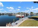 Private boat dock featuring a boat lift providing direct access to scenic waterways at 9619 Valencia Cv, Bradenton, FL 34210