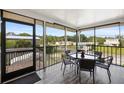 Spacious screened porch with outdoor seating and a view of the neighborhood at 107 Myakka Dr, Venice, FL 34293