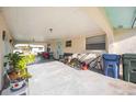 A large, covered carport features room for multiple cars and patio set at 270 E Langsner St, Englewood, FL 34223