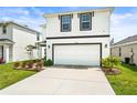 Charming two-story home featuring a clean white exterior and well-manicured lawn, plus a two car garage at 3027 Great Abaco Way, Bradenton, FL 34208