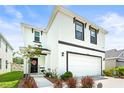 Charming two-story home featuring a clean white exterior and well-manicured lawn, plus a two car garage at 3027 Great Abaco Way, Bradenton, FL 34208