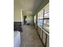 Kitchen with green walls and space for appliance installation with natural light at 305 59Th St, Holmes Beach, FL 34217
