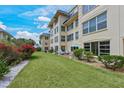 A condo's well-maintained lawn and patio area offer a private outdoor space at 3802 Gulf Of Mexico Dr # A103, Longboat Key, FL 34228