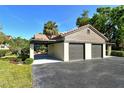 Three-car garage with ample parking space and covered walkway to the front door at 4375 Trails Dr # 17-1, Sarasota, FL 34232