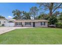 A well-kept single-story home featuring a lush green lawn and fresh exterior paint at 4619 20Th W Ave, Bradenton, FL 34209