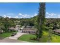 A charming single-story home with a well-maintained lawn and a quaint, tree-lined front yard at 4619 20Th W Ave, Bradenton, FL 34209
