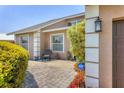 A welcoming entrance features a brick-paved walkway and manicured shrubs at 4704 Coral Lake Dr, Bradenton, FL 34210
