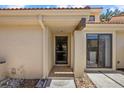 Charming front entrance with tiled walkway and covered porch area at 5346 Huntingwood Ct # 21, Sarasota, FL 34235