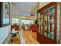 Bright living room featuring hardwood floors, a ceiling fan, and views of the outdoors at 6619 Copper Ridge Trl, Bradenton, FL 34201