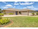 Charming single-story ranch with an attached two-car garage and beautifully manicured lawn at 6820 19Th W Ave, Bradenton, FL 34209