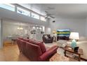 Open-concept living room with high ceilings, tile floors and adjoined to kitchen and dining room at 6946 Woodwind Dr # 2, Sarasota, FL 34231