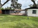 Backyard featuring a fenced-in patio and shed, perfect for outdoor living at 775 Liberty St, Englewood, FL 34223