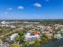 Scenic aerial view of condo complex, lush landscape, waterway, and cityscape at 835 S Osprey Ave # 415, Sarasota, FL 34236