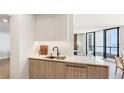 Bright and modern kitchen with a view of the ocean at 1211 Gulf Of Mexico Dr # 309, Longboat Key, FL 34228
