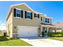 Beautifully landscaped two-story home featuring a spacious two-car garage at 15118 Agave Grove Pl, Bradenton, FL 34212