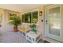 Cozy front porch area with comfortable seating and a view of the neighborhood at 2610 Jefferson Cir, Sarasota, FL 34239