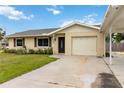 Attractive single-story home with an attached garage and carport, creating ample parking and curb appeal at 4221 3Rd W Ave, Palmetto, FL 34221