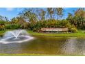 Community water fountain surrounded by lush landscaping and the neighborhood name at 4344 Nizza Ct, Venice, FL 34293