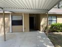 Front view of a charming home with a carport, perfect for easy parking and weather protection at 4944 Village Gardens Dr # 151, Sarasota, FL 34234