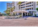 The entrance to the Terrace East condo building with beautiful landscaping and waterfall feature at 5300 Ocean Blvd # 202, Sarasota, FL 34242