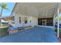 Spacious carport with a screened entry, providing ample parking and outdoor living space at 5619 Bayshore Rd # 423, Palmetto, FL 34221
