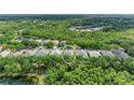 An aerial view of a home nestled in a lush green landscape, highlighting the serene and private setting at 7278 Lismore Ct, Lakewood Ranch, FL 34202