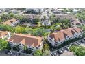 Overhead view of condo community highlighting the well-maintained grounds, pool, and nearby amenities at 850 S Tamiami Trl # 730, Sarasota, FL 34236