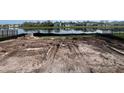 New construction home site with lake view and ample space for a custom pool and backyard oasis at 8760 Windlass Cv, Parrish, FL 34219
