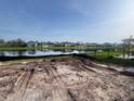 New construction home site with serene lake view, green space, and an ideal spot for outdoor living at 8760 Windlass Cv, Parrish, FL 34219