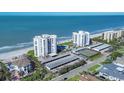 Beachfront condos boast stunning ocean views, a pool, tennis court and covered parking for residents and guests at 1000 Longboat Club Rd # 604, Longboat Key, FL 34228