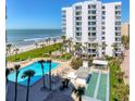 A beachfront condo has a pool, shuffleboard court, and lush tropical landscaping at 1000 Longboat Club Rd # 604, Longboat Key, FL 34228