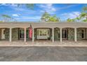 Inviting front entrance with stone accents, covered porch, and double doors for easy access at 1240 Fox Creek Dr, Sarasota, FL 34240