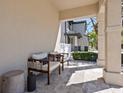 Relaxing front porch featuring a seating area with tiled floor, offering a cozy outdoor space at 2159 Hawthorne St, Sarasota, FL 34239